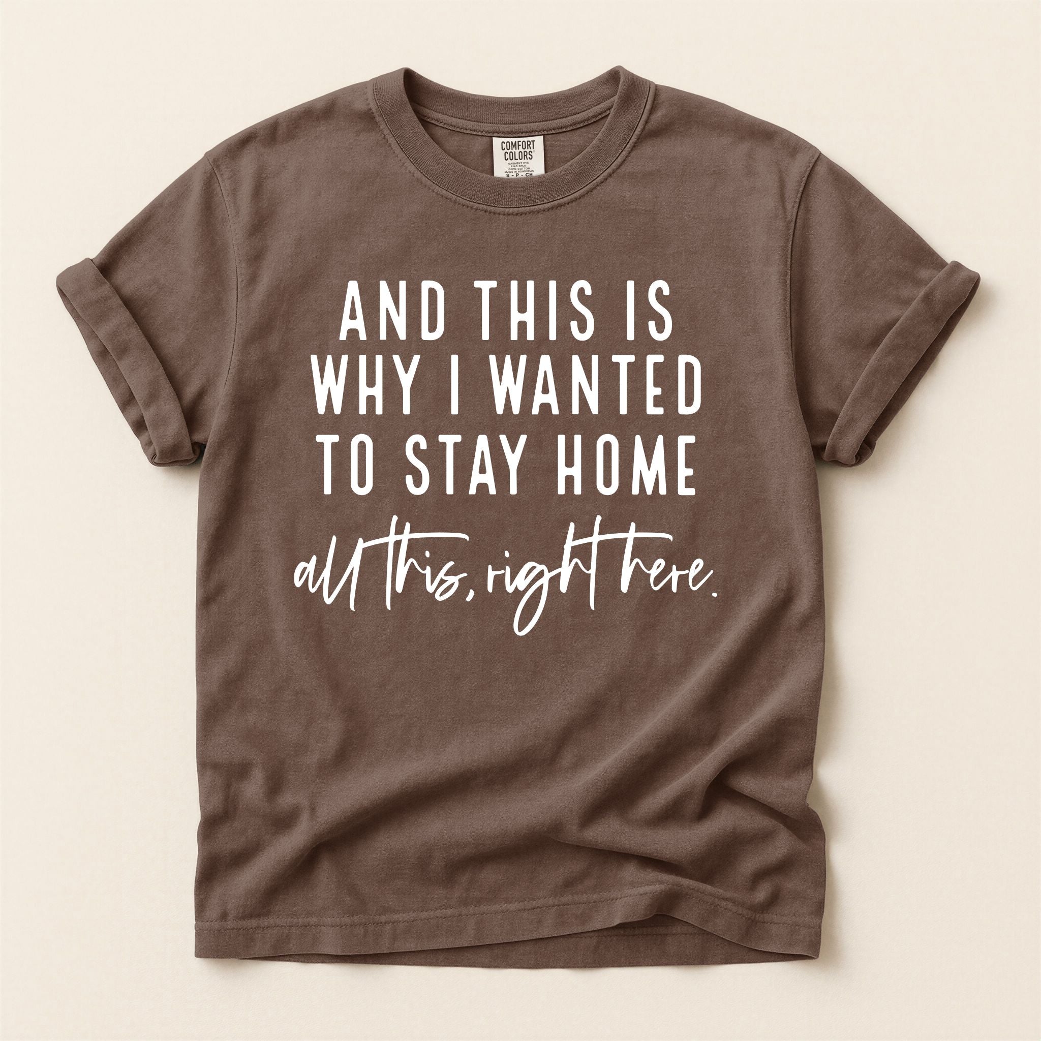 Brown t-shirt with white text on a beige background