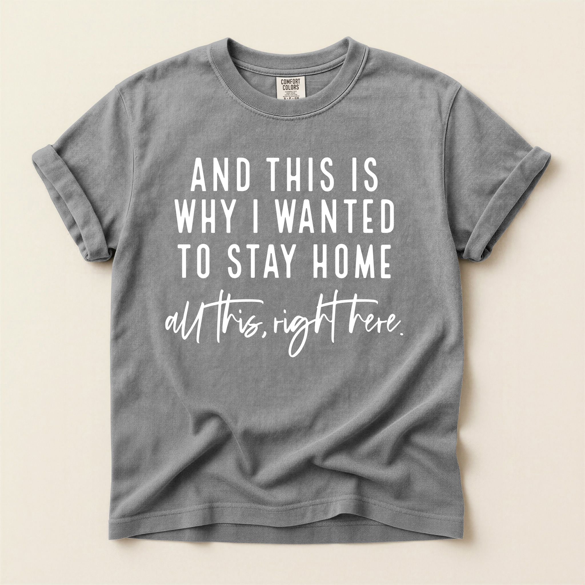 Gray t-shirt with white text on a beige background