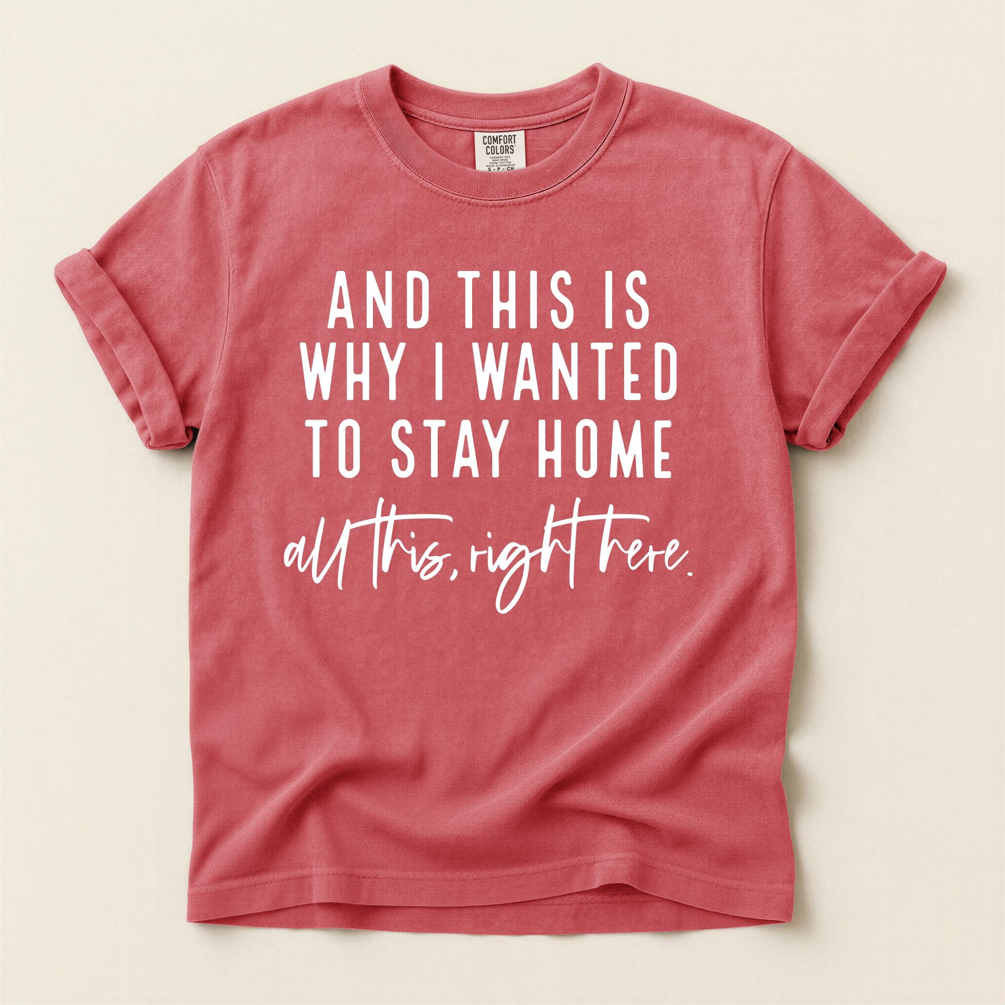 Red t-shirt with white text on a beige background