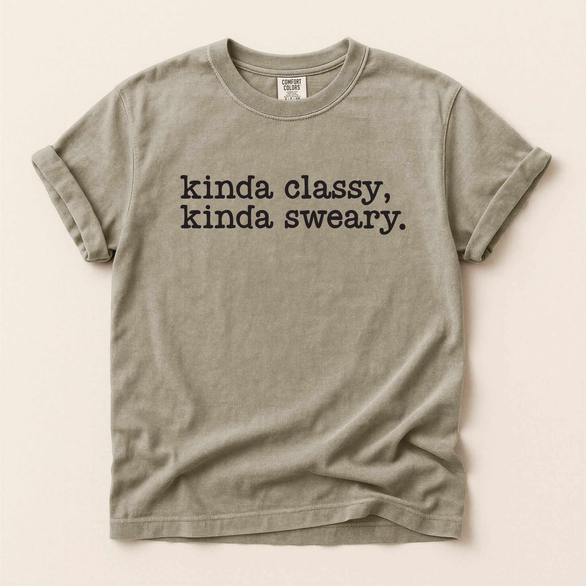Beige t-shirt with text 'kinda classy, kinda sweary.' on a beige background