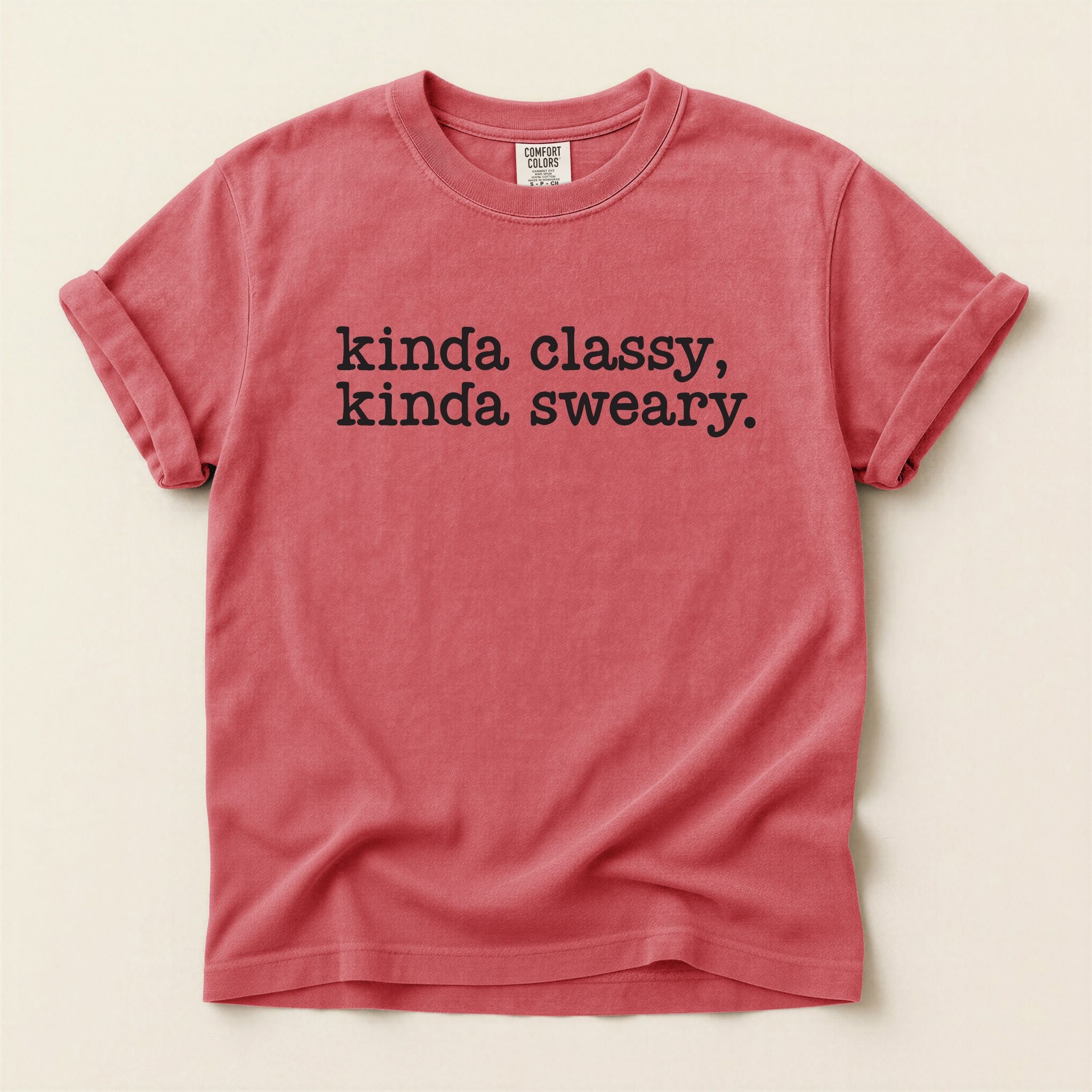 Red t-shirt with black text on a beige background