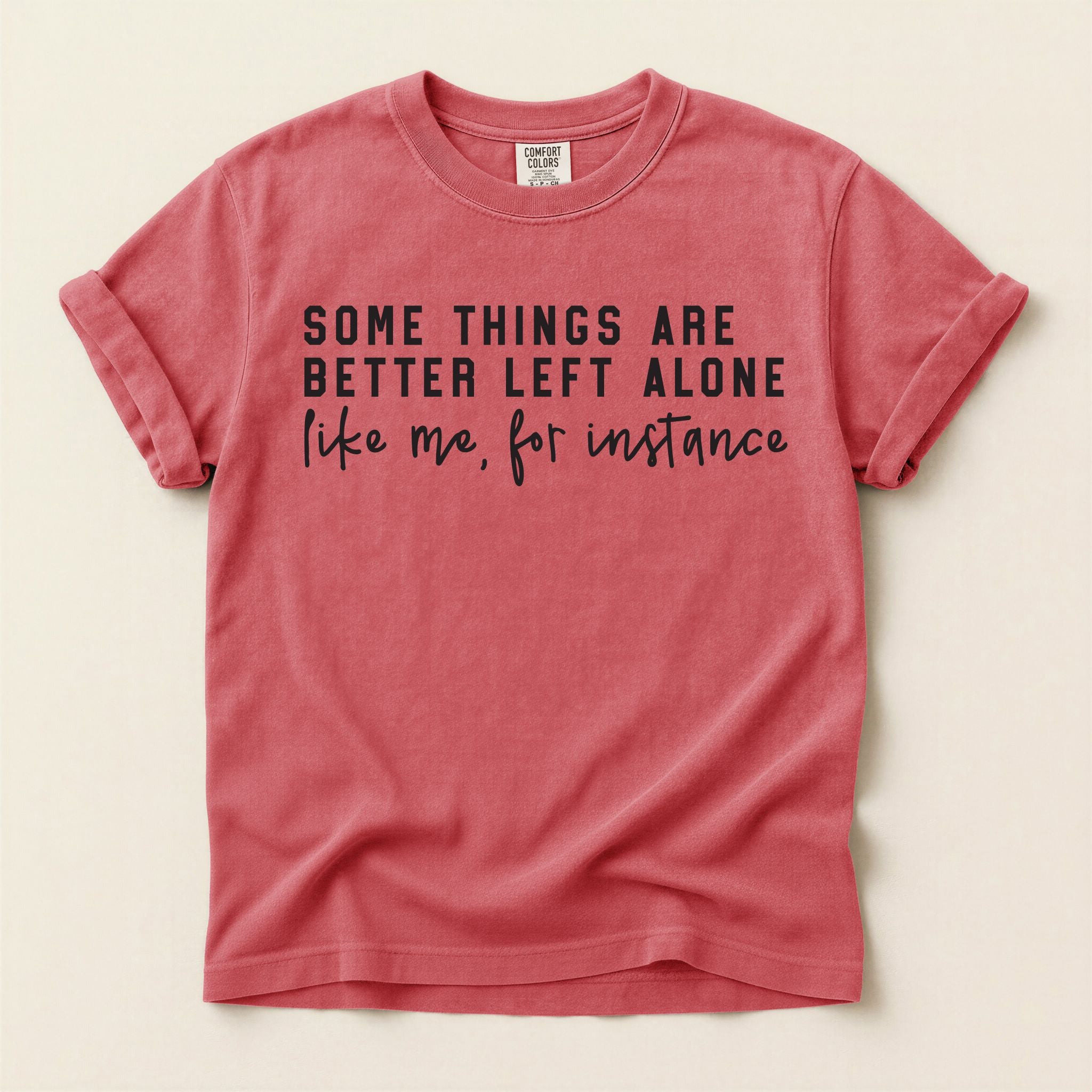 Red t-shirt with black text on a beige background