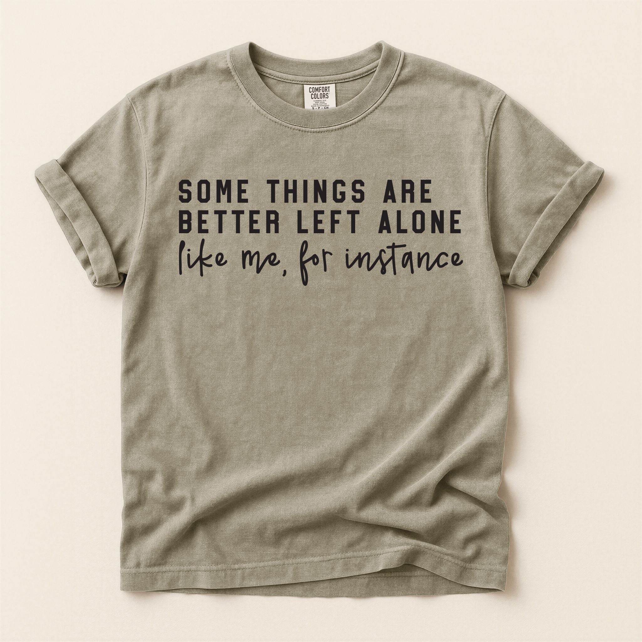 Beige t-shirt with black text on a beige background